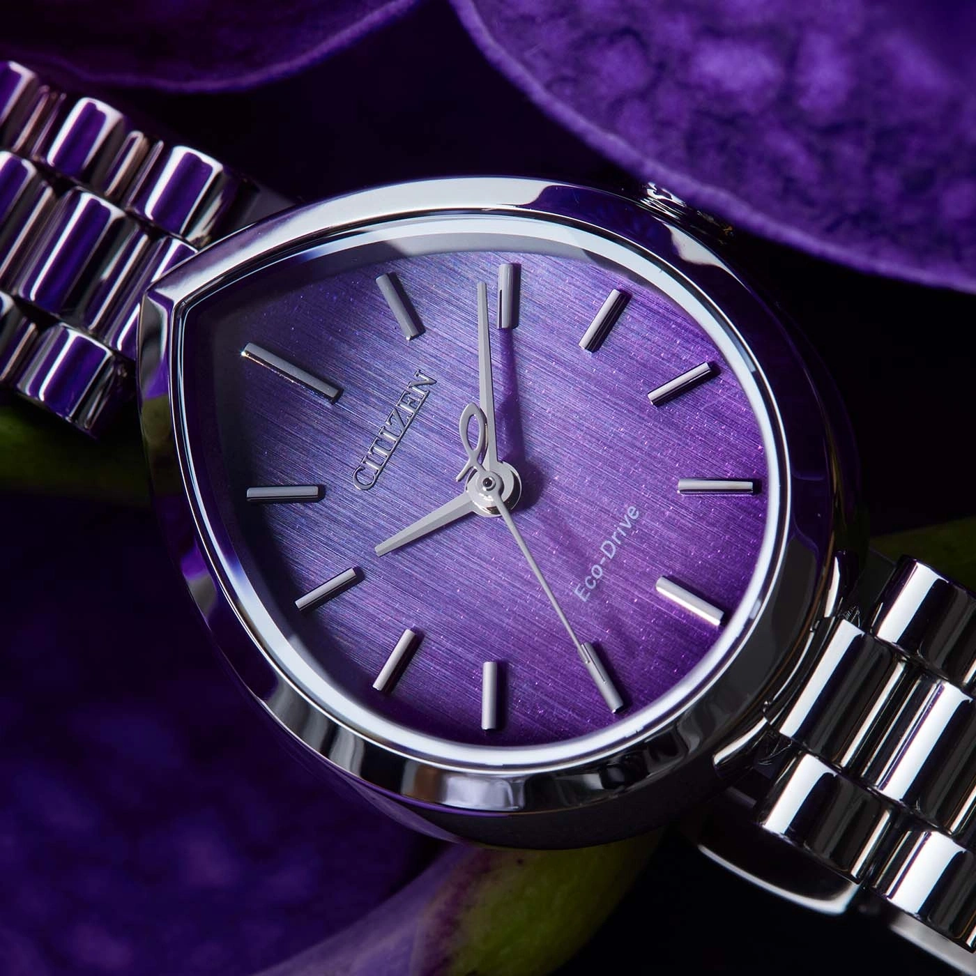 A purple Citizen Eco-Drive watch with a metal band.
