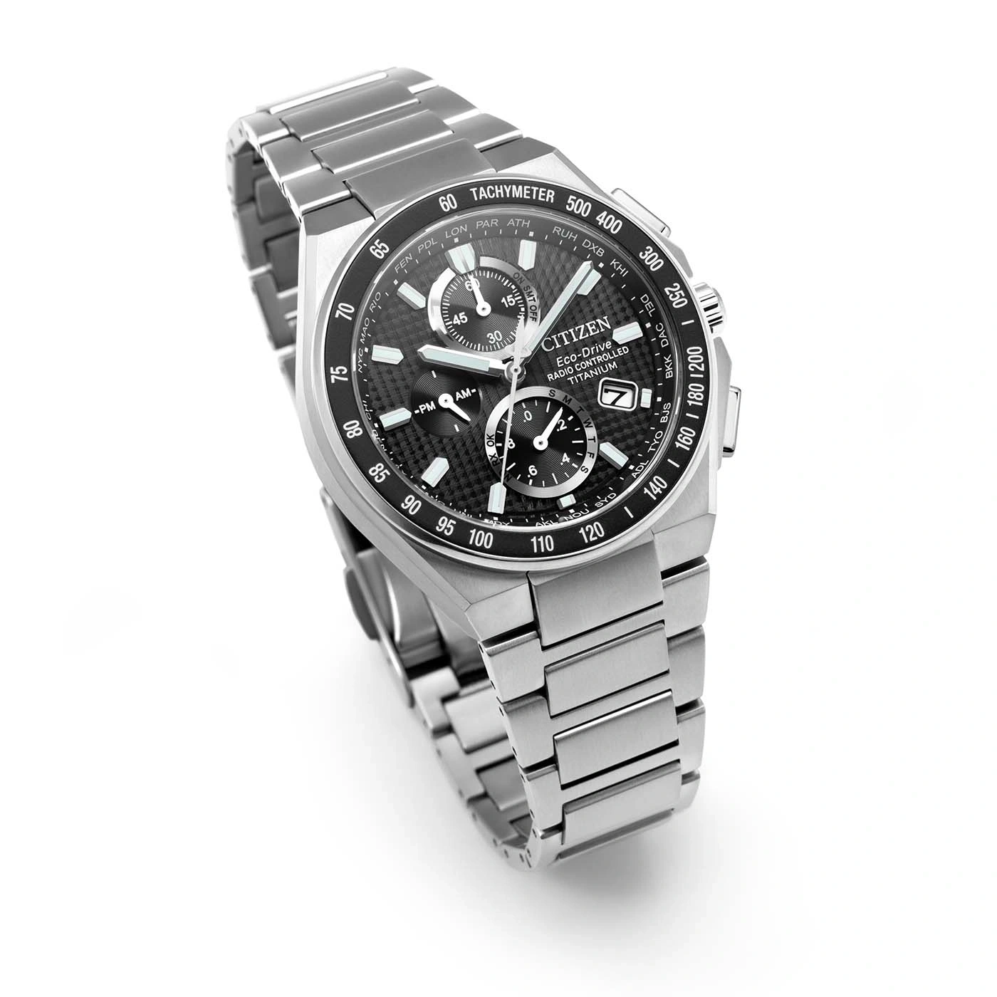 A detailed close-up of a citizen eco-drive radio controlled titanium watch.