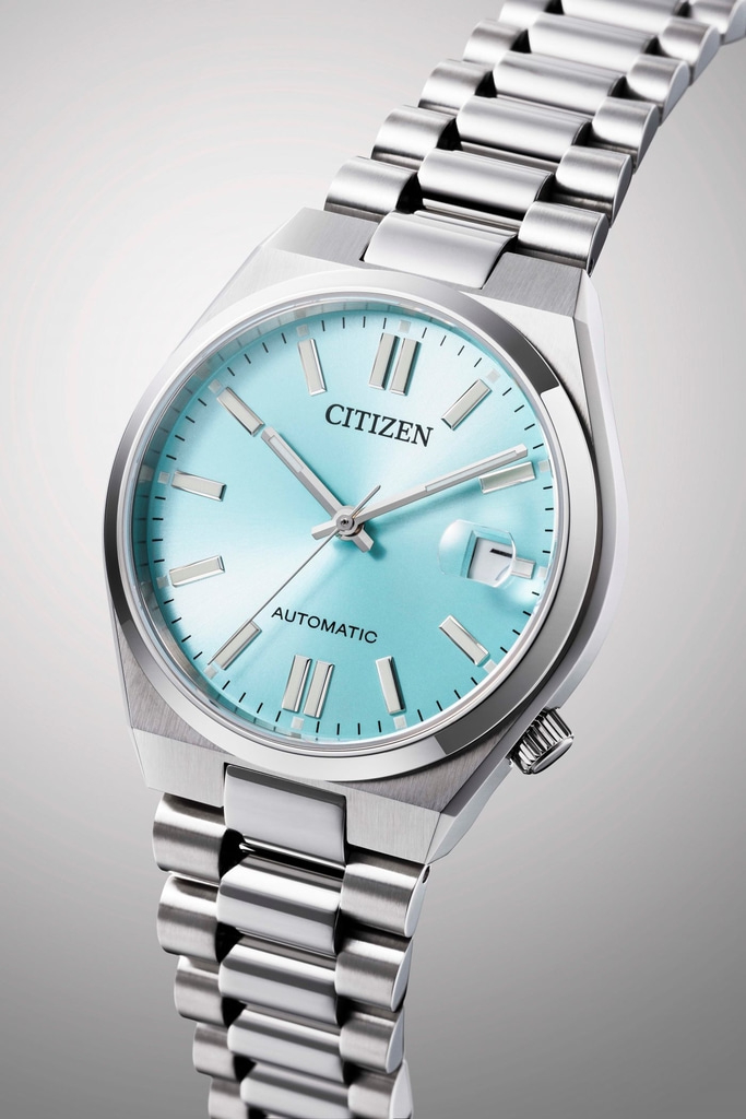 Citizen watch with a light blue face and silver band, automatic.