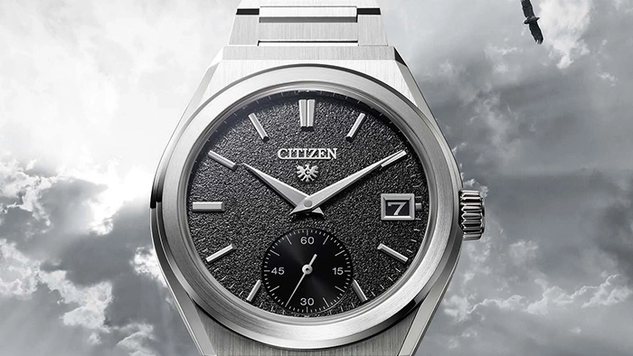 Citizen watch with a black textured dial and a small seconds dial.
