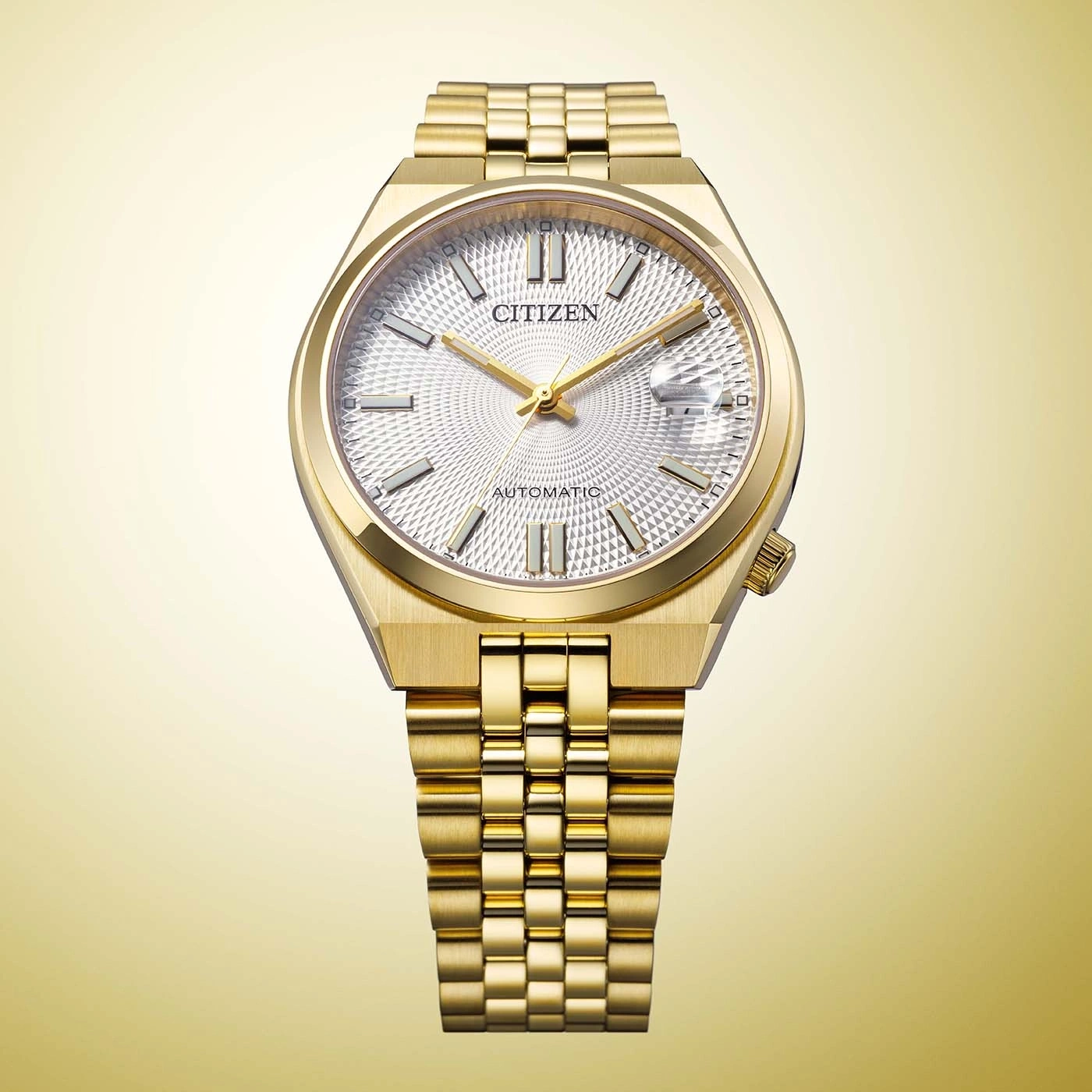 A gold Citizen automatic watch with a patterned white dial.