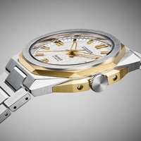 Close-up of a Citizen Series 8 automatic watch with a silver and gold case and bracelet.