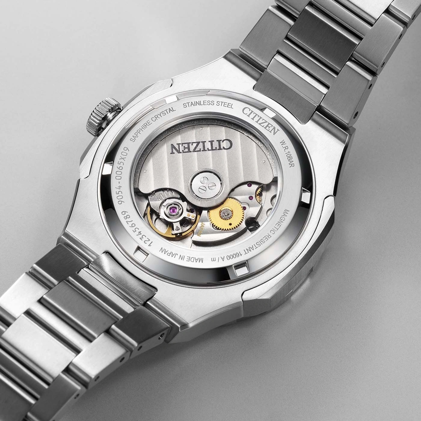 Citizen watch back with visible mechanism, stainless steel, sapphire crystal.