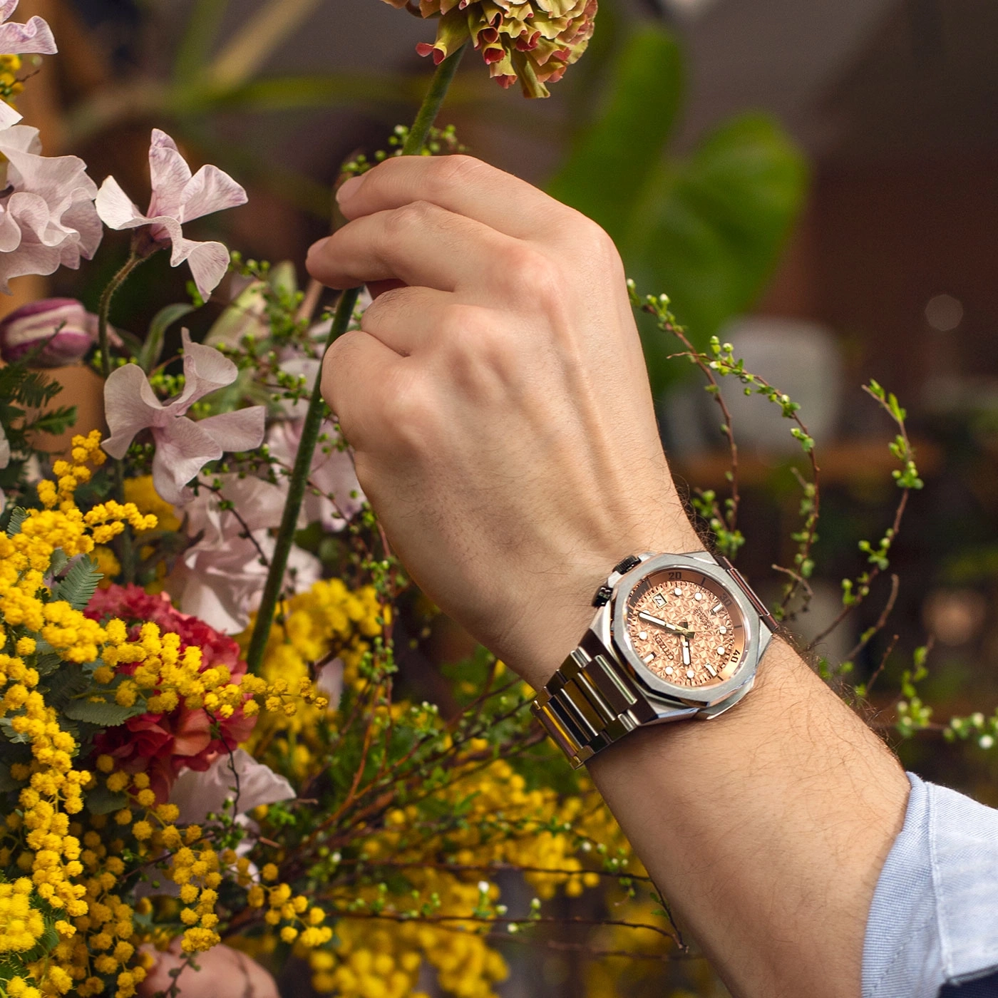 Man's wrist watch with flowers. Silver watch with a rose gold face.