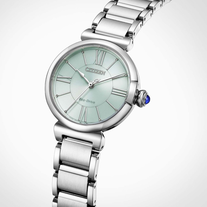 A silver Citizen Eco-Drive watch with a light green face and Roman numerals.