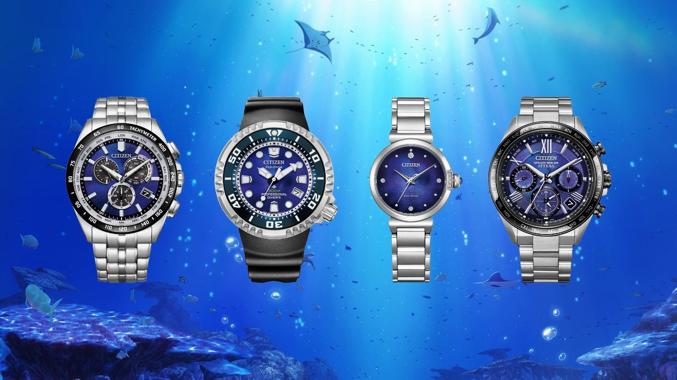 Watches in an underwater scene, Citizen watches with blue dials and metal straps.
