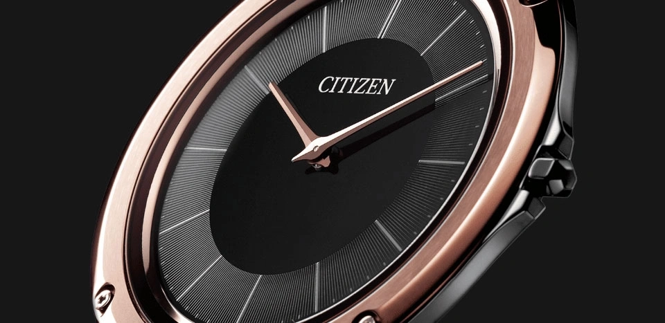 Close-up of a Citizen watch with a black face and rose gold accents.