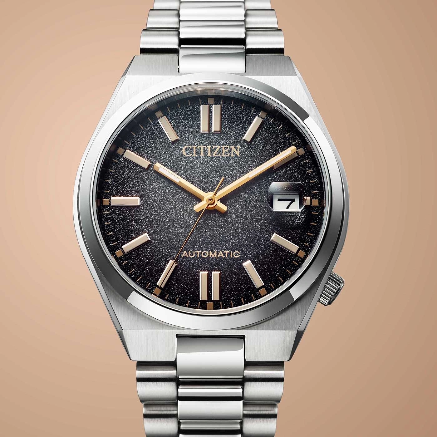 Citizen watch with black face, silver band, and date display. Elegant design.