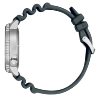 A side view of a silver watch with a black rubber strap.