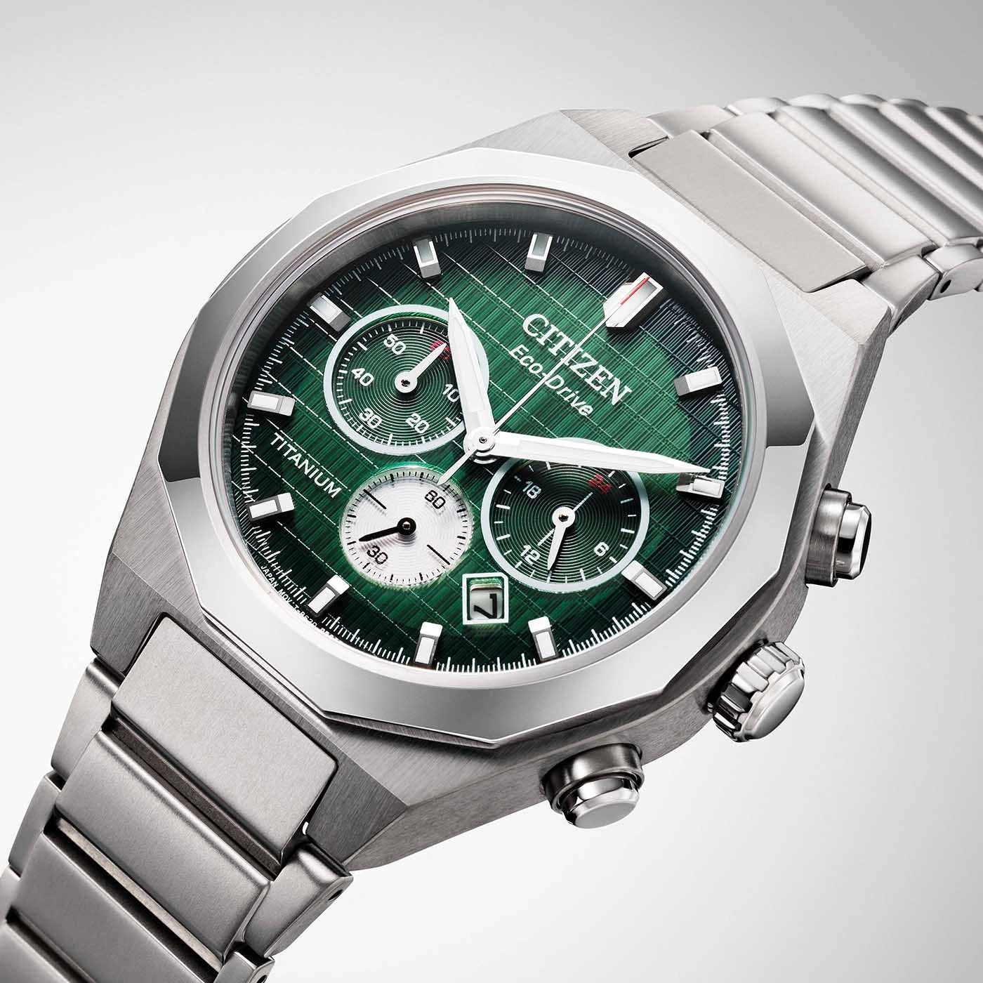 Citizen watch with green face, titanium, Eco-Drive, chronograph, stylish design.
