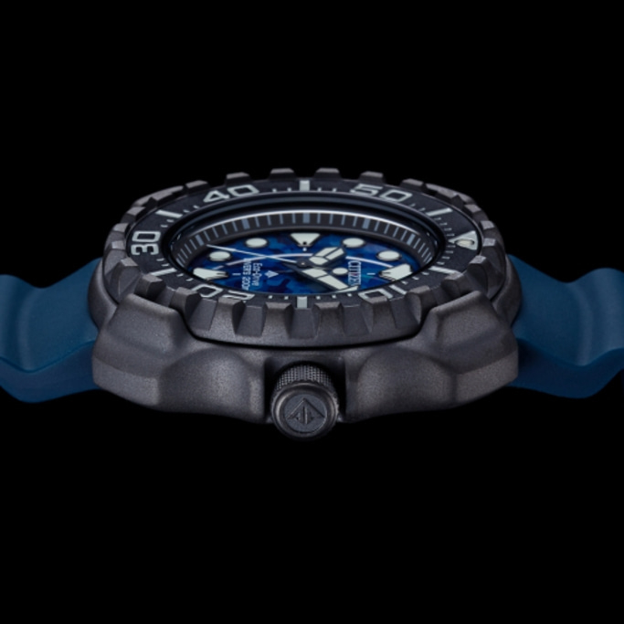 Citizen watch with blue face and strap, black case, side view, close up