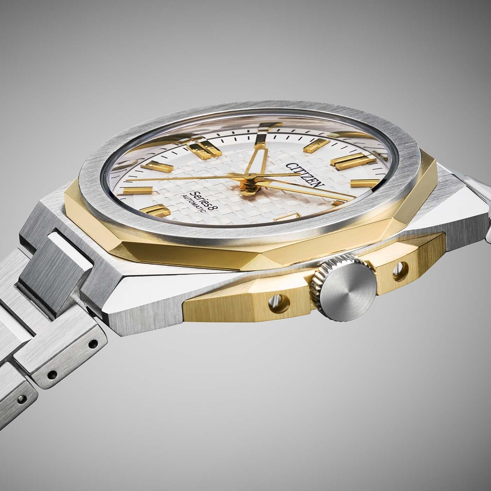Close-up of a Citizen Series 8 automatic watch with a silver and gold case and bracelet.