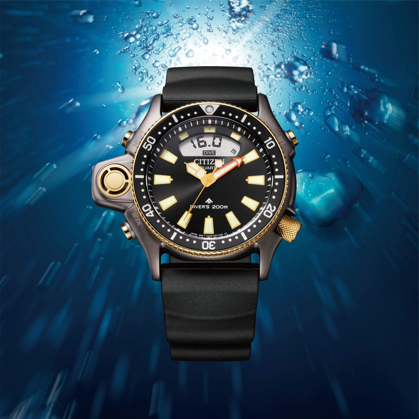 Citizen dive watch underwater with bubbles, black and gold details, depth display.