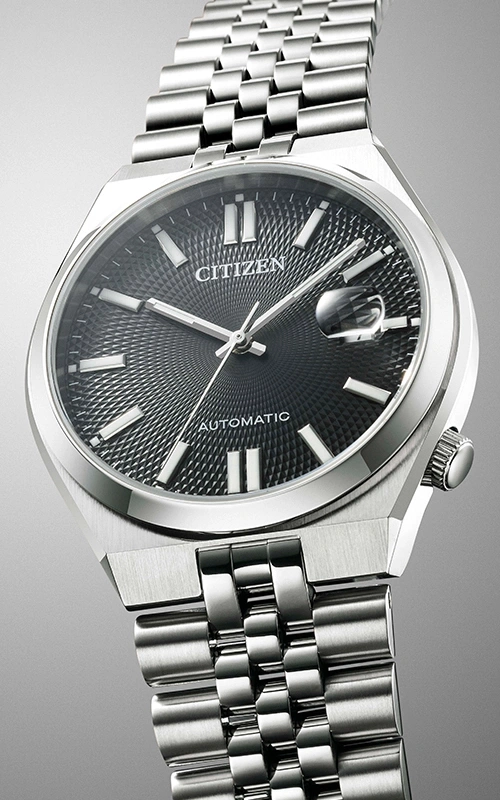 Citizen automatic watch with a black dial and silver bracelet.