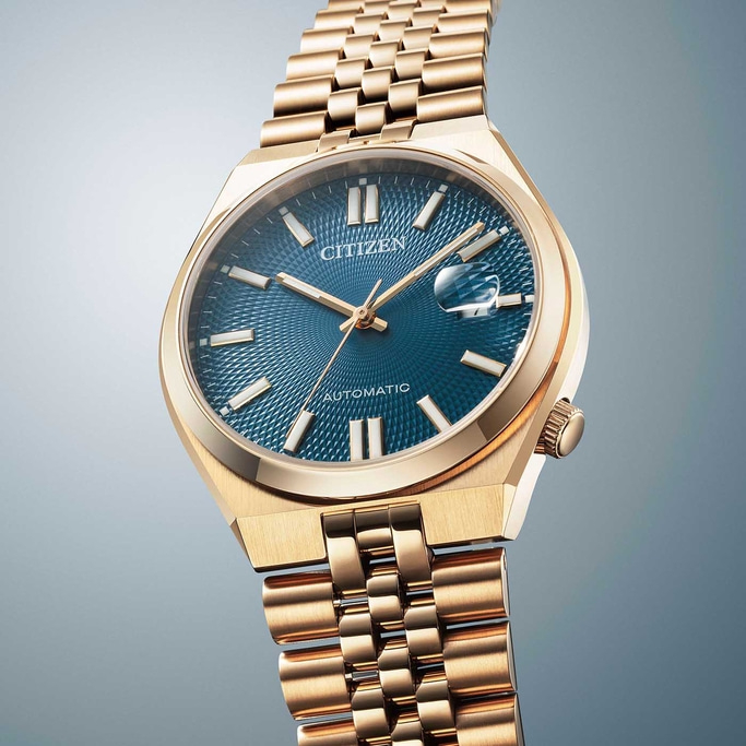 Gold Citizen watch with blue face and gold bracelet, elegant design.