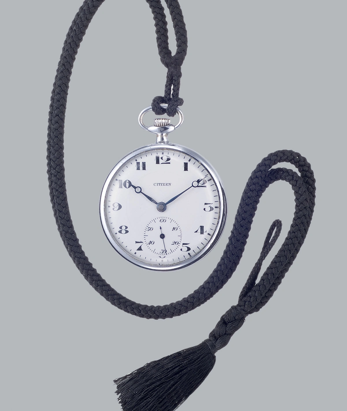 Pocket watch with black cord and tassel, Citizen brand, silver case, white face.