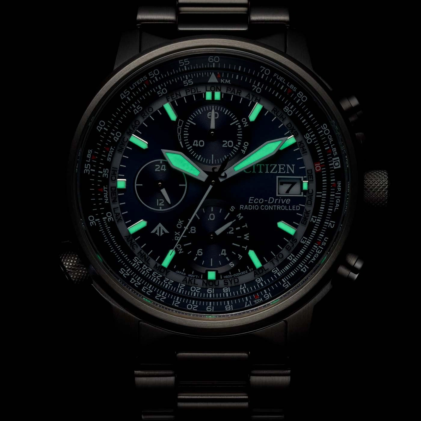 Close-up of a Citizen Eco-Drive watch with glowing green accents and intricate details.