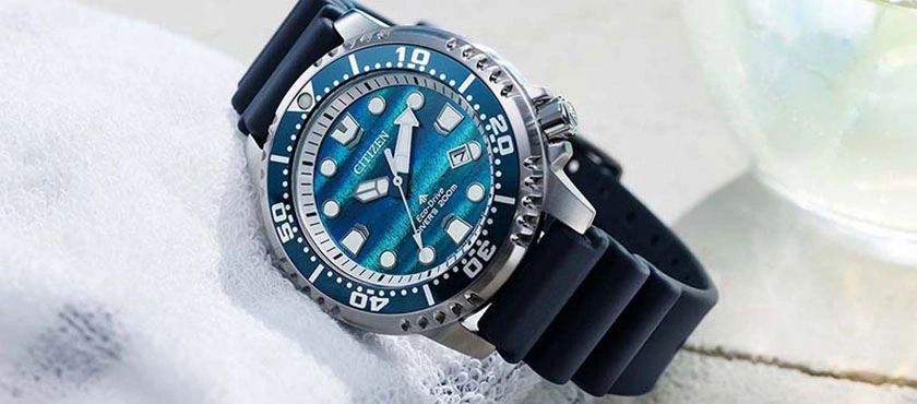A blue Citizen Eco-Drive diver's watch on a rubber strap.