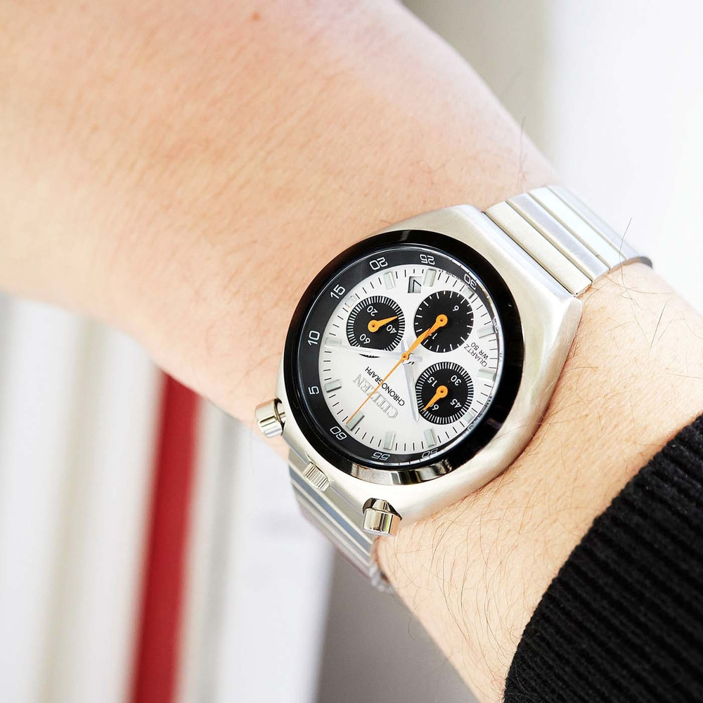 A close-up of a Citizen chronograph watch on a wrist.