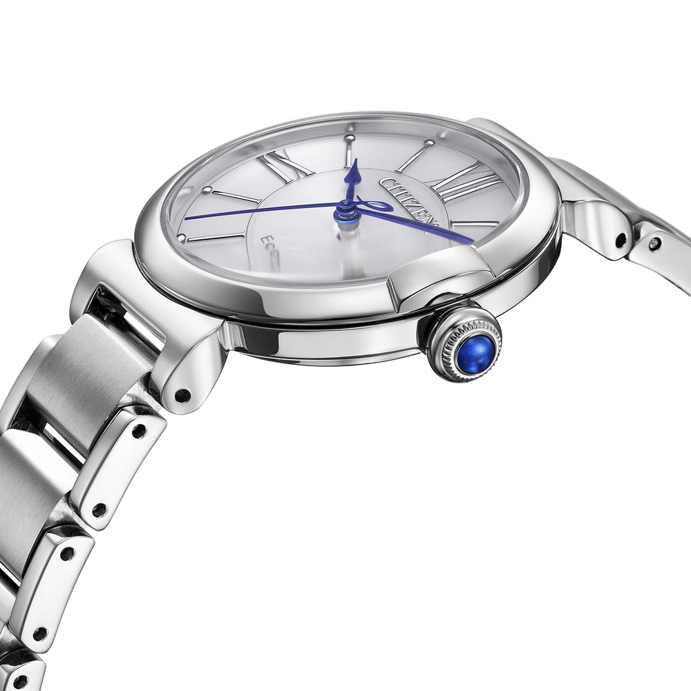 A close-up shot of a silver Citizen Eco-Drive watch with blue hands and a blue gem on the crown.