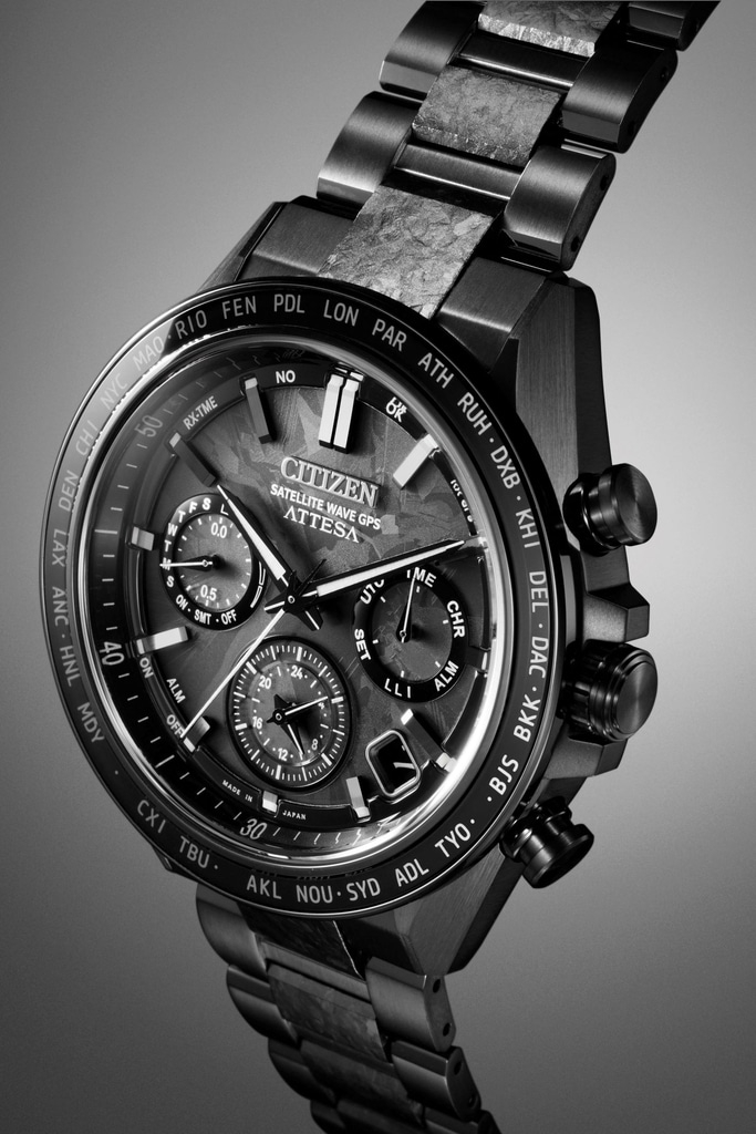 Close-up of a Citizen Attesa watch with a black metal band and face.