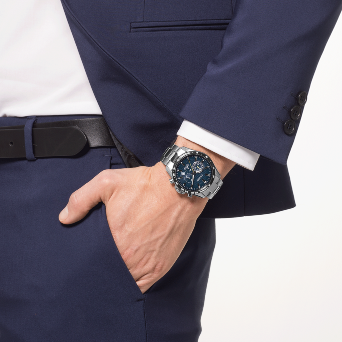 Man in suit with watch, hand in pocket, business attire, formal wear