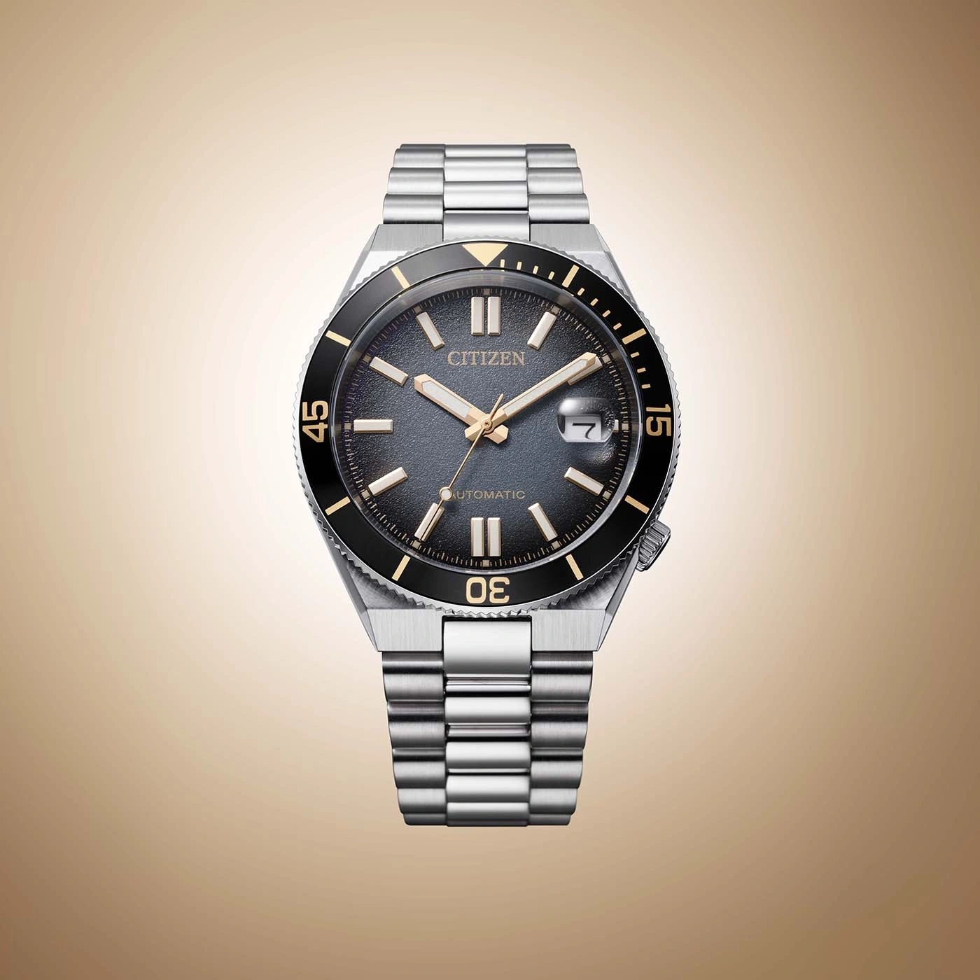 A Citizen automatic dive watch with a grey dial and gold accents.