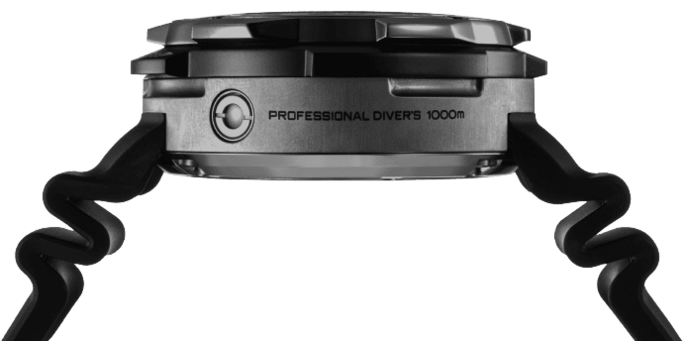 Close-up of a professional diver's watch with a black strap and text.
