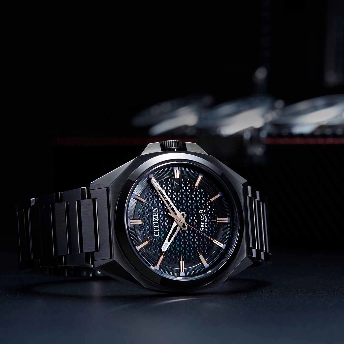 Black Citizen watch with a patterned dial and a black bracelet.