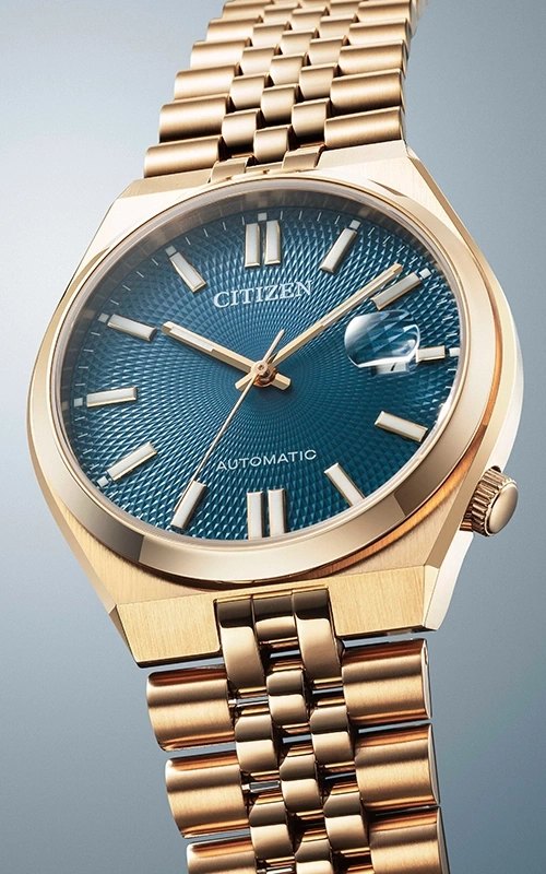 Gold Citizen watch with a blue dial and gold bracelet.