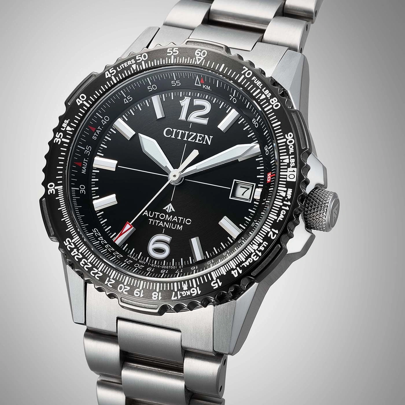 A citizen automatic titanium watch with a black dial and metal band.