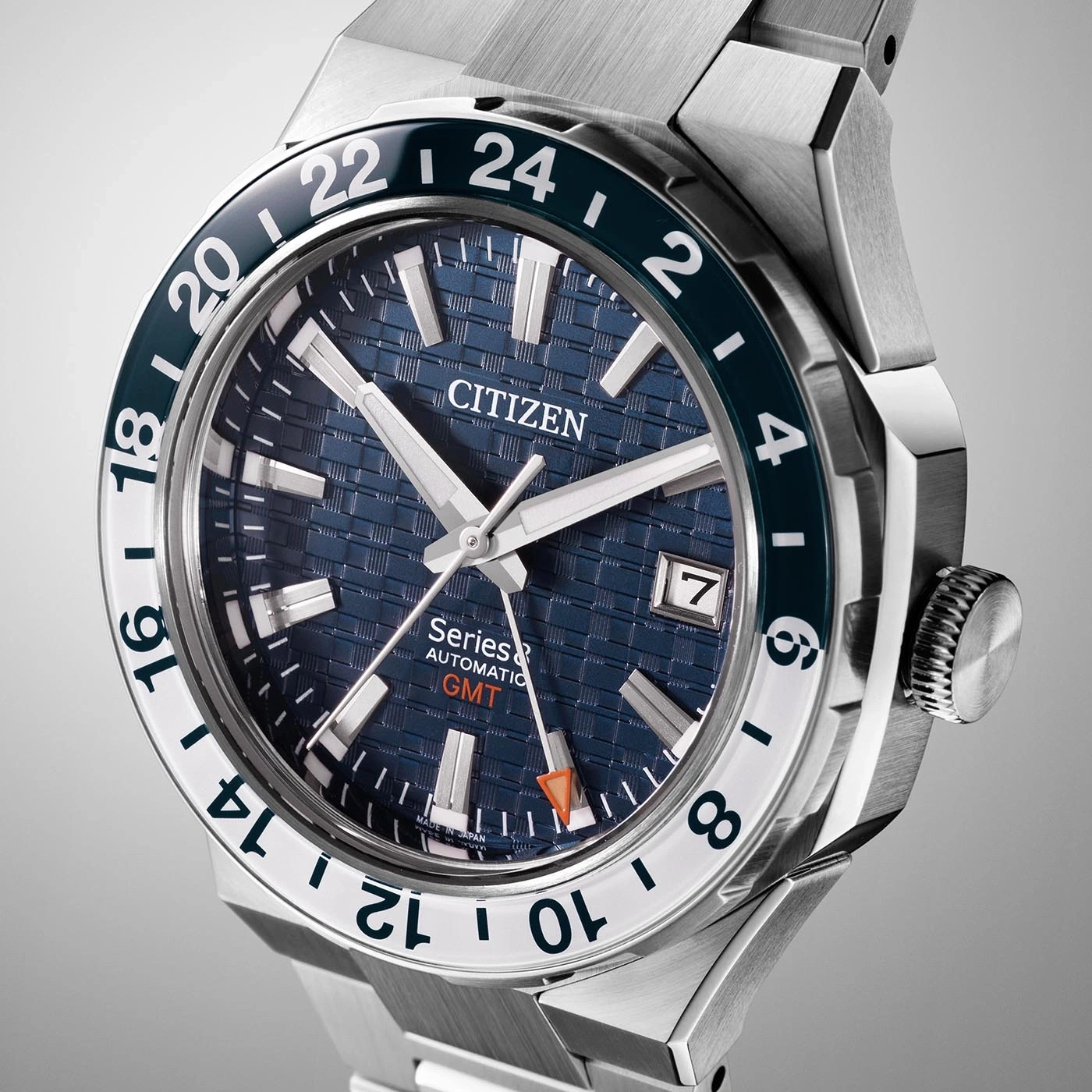 Citizen watch with blue face, white hands, and GMT bezel.
