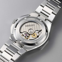 Back of a Citizen watch with visible movement and metal band.