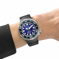 Citizen Eco-Drive watch on wrist, blue dial, black strap, professional diver's watch