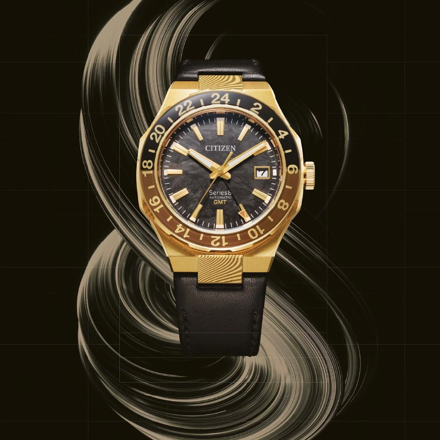 A gold Citizen automatic GMT watch with a black dial and leather strap.