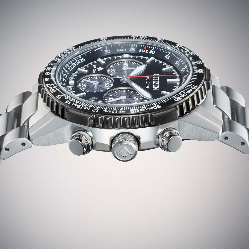 Close-up of a Citizen Eco-Drive watch with a black dial and metal band.