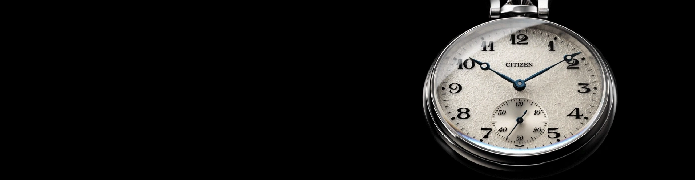 Close-up of a Citizen pocket watch with a black background.