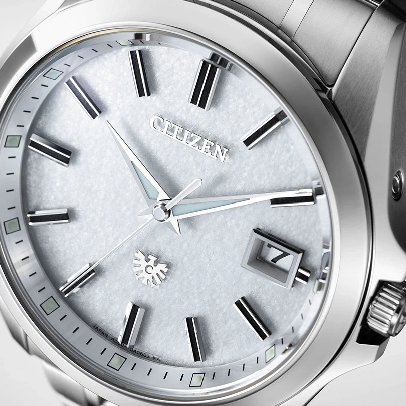 Close-up of a Citizen watch with a silver face and hands.