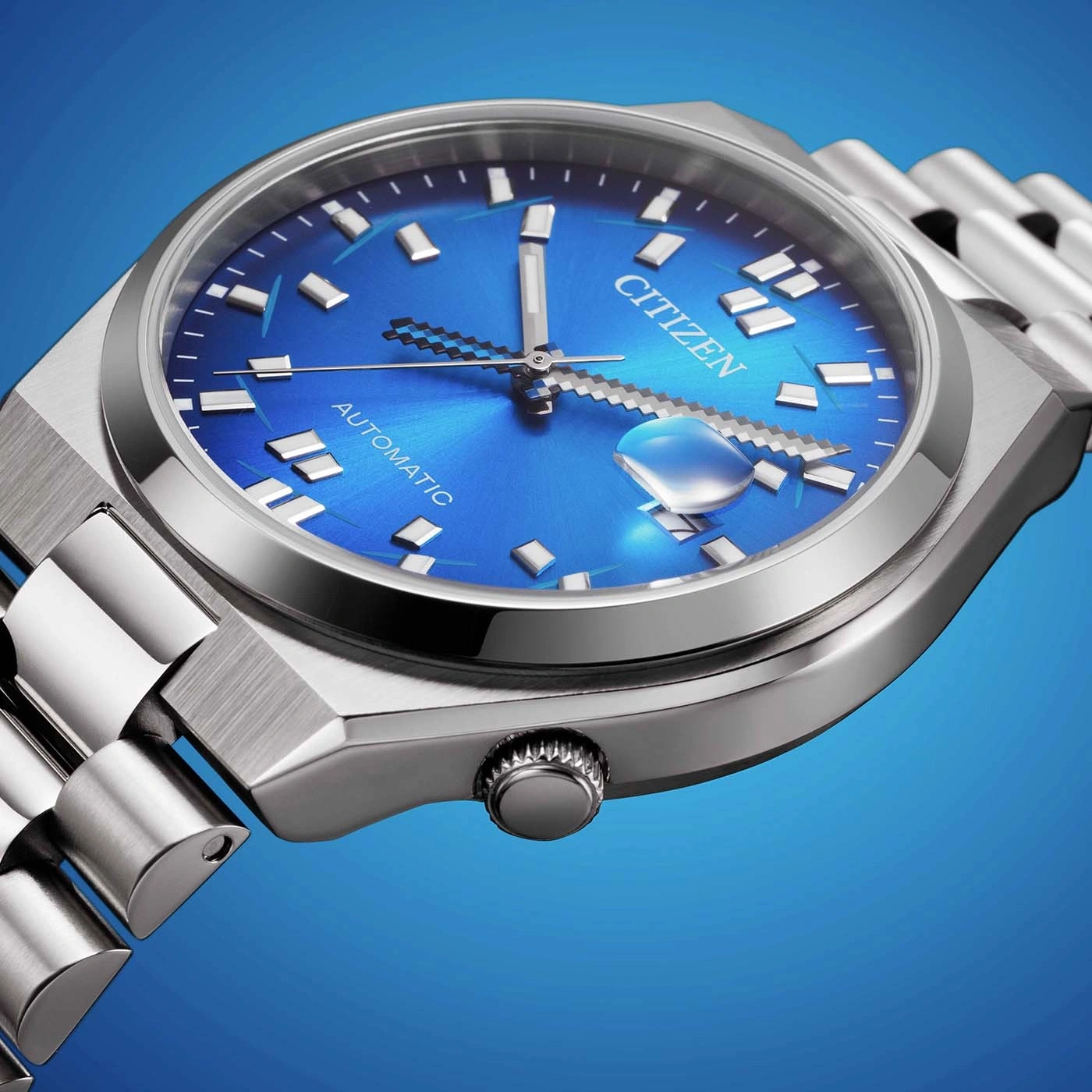Close-up of a blue Citizen automatic watch with a metal band.