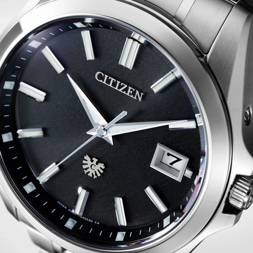 Close-up of a Citizen watch with a black dial and silver accents.