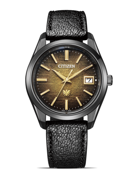 Citizen-Uhr mit schwarzem Armband und goldenen Akzenten auf grünem Hintergrund