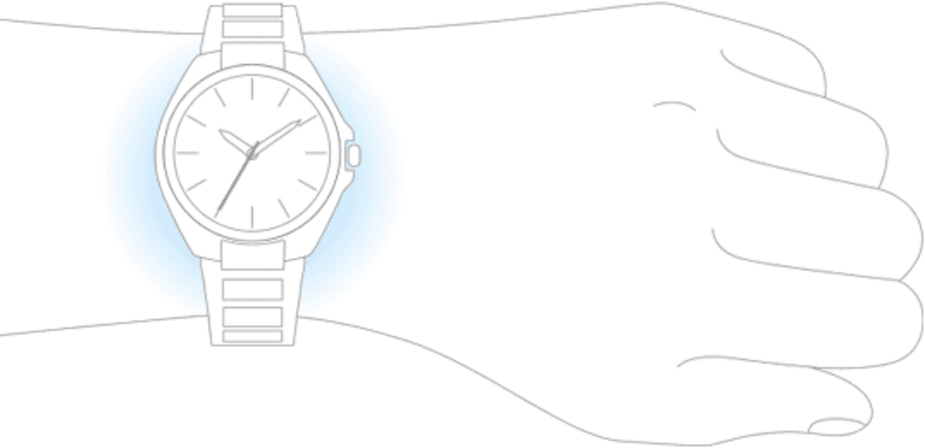 A wrist with a watch on it, the hand is in a fist.