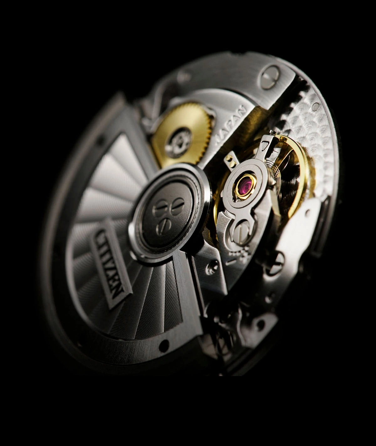 Close-up of a Citizen watch mechanism with intricate details and gears.