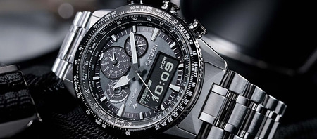 Close-up of a Citizen watch with a detailed dial and metal band, showing time.