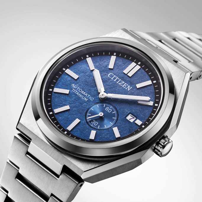 Citizen watch with blue face and titanium band, elegant design, close-up shot