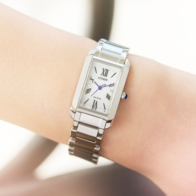Citizen watch on wrist, silver, white face, Roman numerals, Eco-Drive, elegant design
