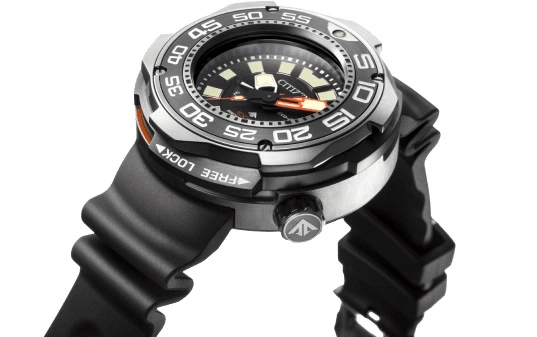 Close-up of a Citizen watch with a black rubber strap and a silver bezel.