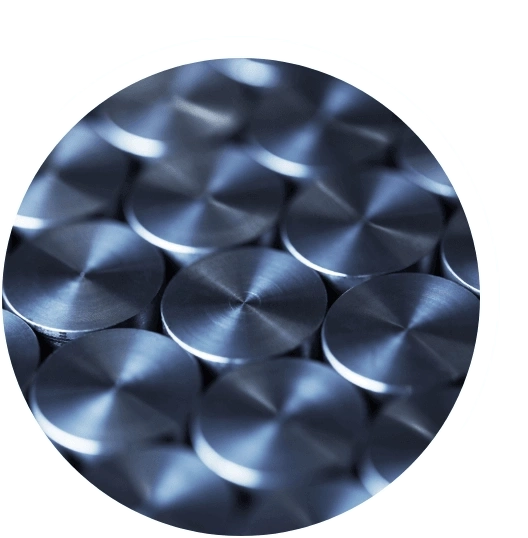 Close-up of shiny metal discs arranged in a pattern, industrial